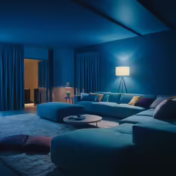 there are lots of pillows on the sofa in this living room