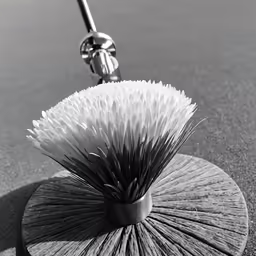 a vase is shaped like a spiral brush