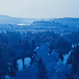 a landscape photo taken over a river and trees