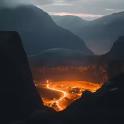 a mountain top with a road winding into it