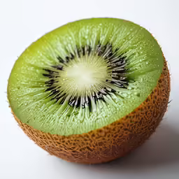 closeup of a cut kiwi fruit with the middle section exposed