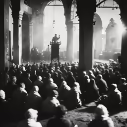 a man standing at a podium in front of an audience