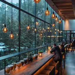 many people are sitting and drinking at a restaurant