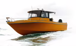 the yellow boat is going across the ocean on very high water