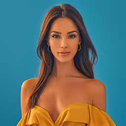 a woman in yellow is posing for a picture