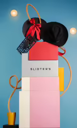 an assortment of accessories are displayed against a blue background