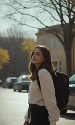 woman wearing black skirt walking with back pack on shoulder