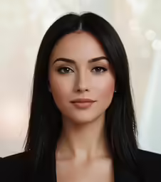 an elegant woman with shoulder length straight black hair and a serious face expression