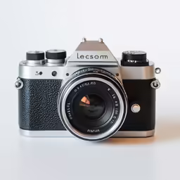 a very nice looking camera on a white surface