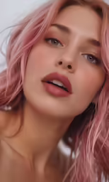woman in pink hair with eyes closed and lipstick in foreground