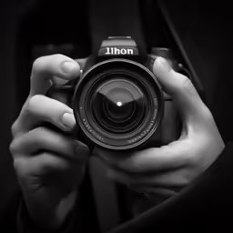 a person taking a picture with a camera