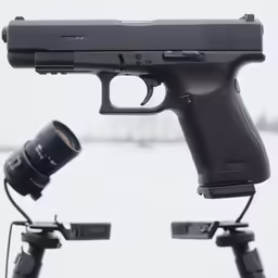 a close up of a gun and a cup on top of it