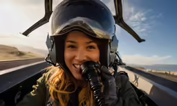 an attractive woman wearing a helmet and holding a pipe