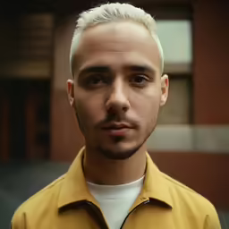 a man wearing a jacket in a close up picture