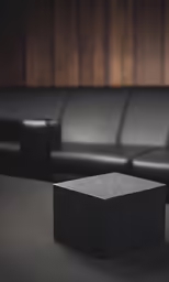 a large square object in front of a couch