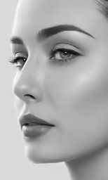 a woman with silver eyeshades wearing a pair of ear clips