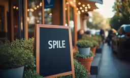 a sign with the word spill is next to a store