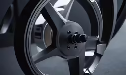 a wheel and hub of a vehicle with a blue background