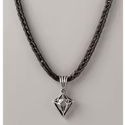 a close up of a necklace with a pendant
