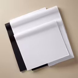 two pieces of paper folded on top of each other