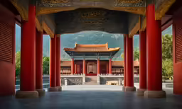 an oriental building that has columns at the top and a roof to top