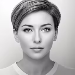 a black and white photo of a woman with short hair