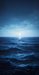 the sun is in a blue, dark sky over rough water