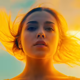 woman with wind in her hair looking at camera