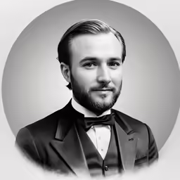 a man with a suit and bow tie