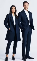 two people in business attire are posing for the camera