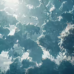 leaves are on the tree as seen through the raindrops