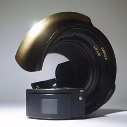 the lens inside of a camera, with a speaker on it