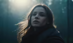 the woman is in the dark forest and it looks like she was crying