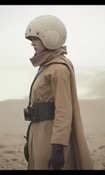 a woman is wearing a trench coat and riding a motorcycle helmet