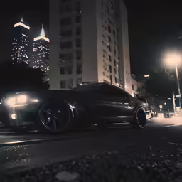 a sports car sits in front of a building at night