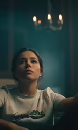 the woman is waiting for her turn in the room