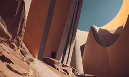 the large buildings are all made out of orange and grey stone