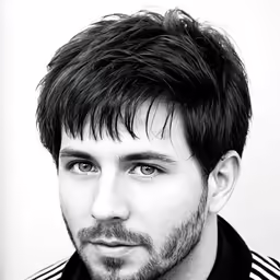 a guy with short hair and a beard looks into the camera