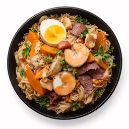 this is an oriental noodle dish with eggs, ham, carrots, and mushrooms