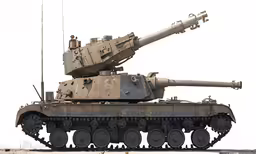 a military tank is parked with an attached missile attached to it