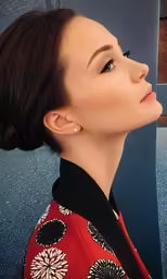 a woman with a black and red jacket
