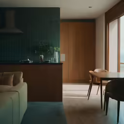 a kitchen and living area with a large window