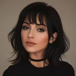 a young lady with dark hair wearing black