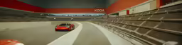 a red sports car going around a corner