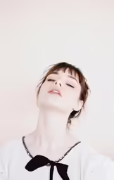 a woman is breathing in a black and white dress
