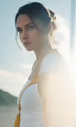 a woman standing near a body of water