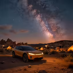 a yellow sports utility vehicle parked at night