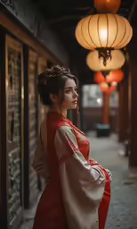the woman is standing in front of lanterns