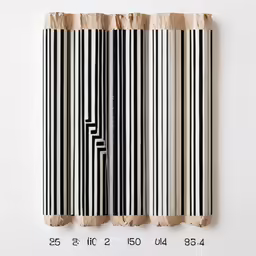a sheet of paper with black and white stripes taped in half