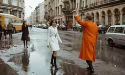 a man is directing a woman to cross the street